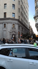 Madrid street intersection bustling during late afternoon hours