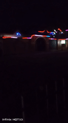 Community celebration with lights spans day to night