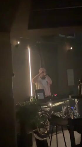 DJ performs at dimly lit bar in Stara Zagora