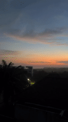 Witnesses document sunset views over residential area April 23
