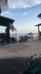 Evening beach activity captured in Porlamar, Venezuela