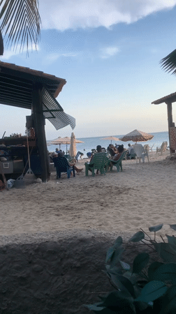 Evening beach activity captured in Porlamar, Venezuela