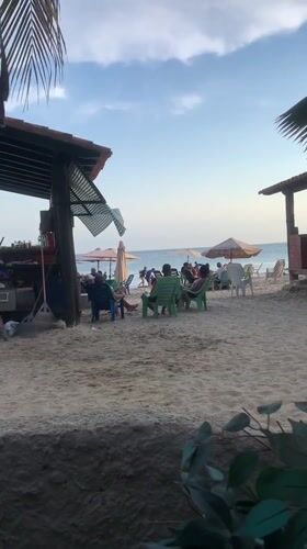 Evening beach activity captured in Porlamar, Venezuela