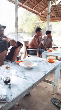 Rural Indonesian community life documented in outdoor gathering spaces