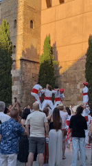 Traditional human towers and giant puppets draw crowds in Barcelona