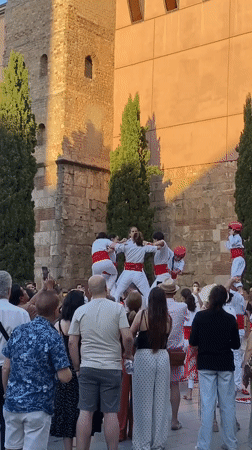 Traditional human towers and giant puppets draw crowds in Barcelona