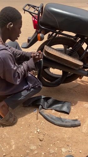 Daily life unfolds across Nigerian neighborhoods: repairs, cooking, commerce