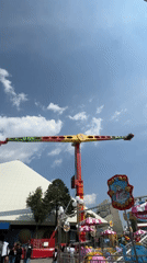Evening crowds enjoy rides at Puebla amusement park