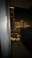 Couple documents casual Sunday evening at Belgrade high-rise apartment