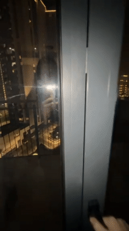 Couple documents casual Sunday evening at Belgrade high-rise apartment