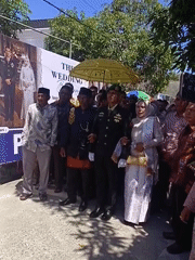 Traditional wedding procession with ceremonial dress in rural Indonesia