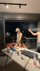 Tel Aviv apartment party features rooftop dancing, card games