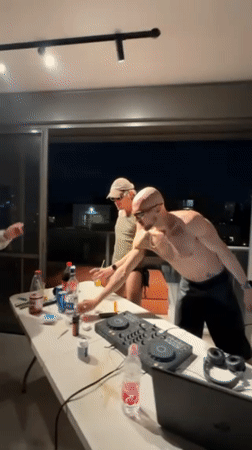 Tel Aviv apartment party features rooftop dancing, card games