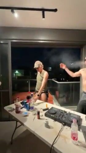 Tel Aviv apartment party features rooftop dancing, card games