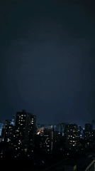 Dramatic purple lightning illuminates Chongqing skyline during evening storm