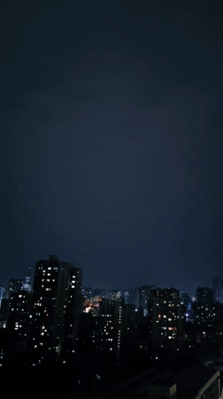 Dramatic purple lightning illuminates Chongqing skyline during evening storm