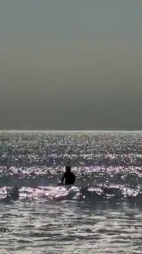 Early morning surfer spotted in Kamakura waters