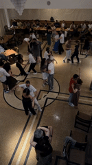 Couples dancing at a casual social gathering in Baku