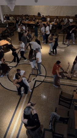 Couples dancing at a casual social gathering in Baku