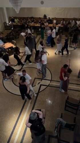 Couples dancing at a casual social gathering in Baku