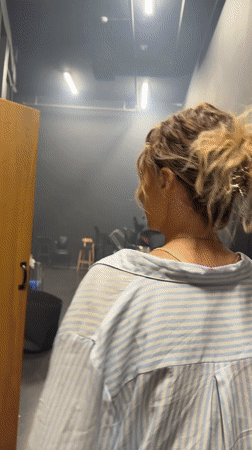 Playful shushing gesture caught backstage in Tel Aviv