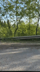 Vehicle travels cracked road with guardrails in Perm, Russia