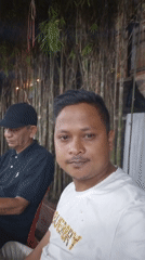Two men filmed in casual setting in Lhokseumawe