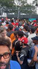 Crowd in Ferrari caps gathers at Miami Gardens venue