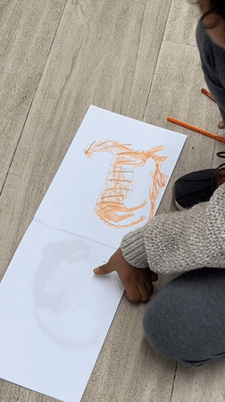 Gallery visitor views Zurab Getsadze paintings at Tbilisi's Vanda Gallery