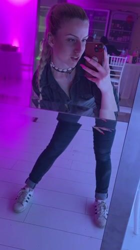 Woman takes mirror selfies in Rakovski, Bulgaria