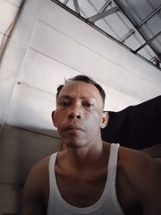 Overturned truck on road in Bukit Ketok, with nearby selfies