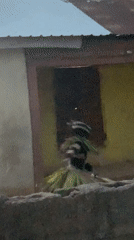 Traditional ceremonial figure walks through Akwanga streets