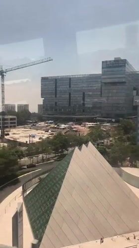 Train passenger films Mexico City skyline with construction activity