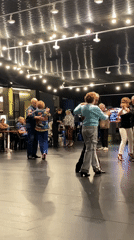 Older couples dance together in Buenos Aires performance venue