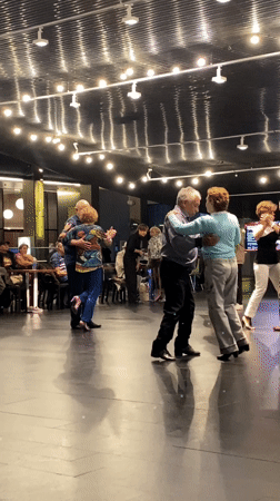Older couples dance together in Buenos Aires performance venue