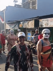 Community parade rolls through Gedangan with costumed groups