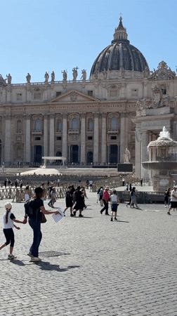 Crowds gather in St. Peter's Square on sunny Friday afternoon