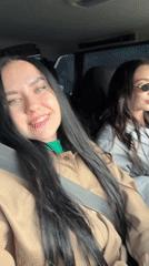 Two women drive through forest near Chaikovsky, Russia