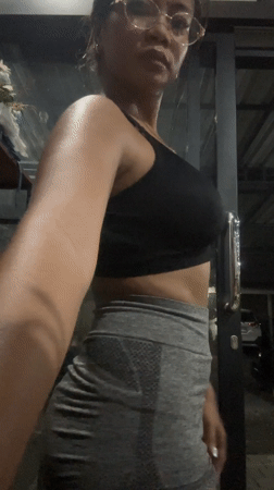 Woman records gym selfie in Batubulan, Indonesia
