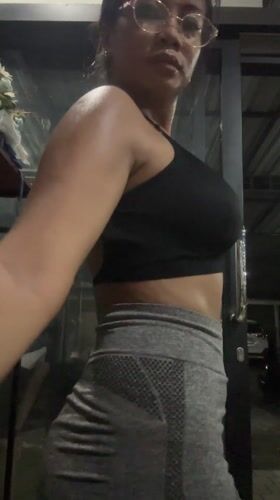 Woman records gym selfie in Batubulan, Indonesia