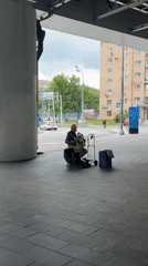 Selfies and street music at a Moscow architectural landmark