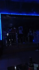 Club night in Barden Yana, Nigeria, with neon lights and dancing