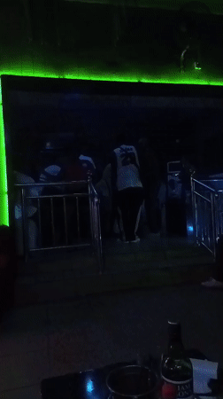 Club night in Barden Yana, Nigeria, with neon lights and dancing