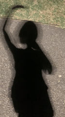 Shadow play on sun-warmed pavement in San Quirico d'Orcia