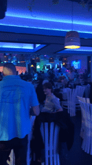 Restaurant celebration in Plovdiv features dancing, bear costume performer