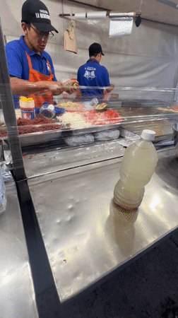 Late-night taco vendor serves customers in Mexico City