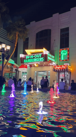 Colorful fountain illuminates In-N-Out restaurant in Paradise overnight