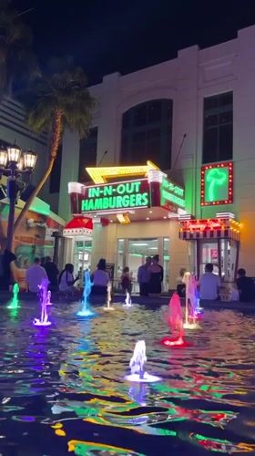 Colorful fountain illuminates In-N-Out restaurant in Paradise overnight