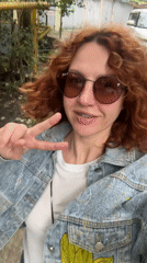 Person makes peace sign gesture in Sochi, Russia