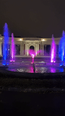 Bilbao fountain lights up the night in front of a neoclassical colonnade